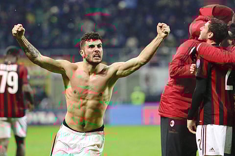 AC Milan's Patrick Cutrone celebrates after scoring for his team during an Italian Cup quartes against Inter Milan at the San Siro stadium. | AP