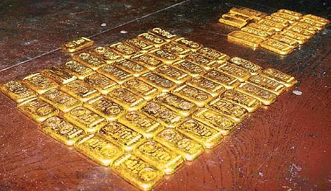 Gold bars image used for representation.