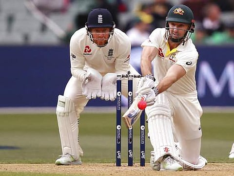 Australia's Shuan Marsh, right, attempts to sweep the ball in front of England's Jonny Bairstow during the second day of their Ashes test match in Adelaide. | AP