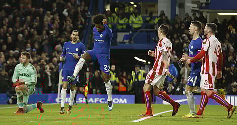 Chelsea's Willian celebrates after scoring his side's 4th goal from the penalty spot against Stock | AP