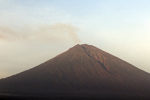 Gushing ash from Bali's Mount Agung volcano has dissipated into a wispy plume of steam. | AP