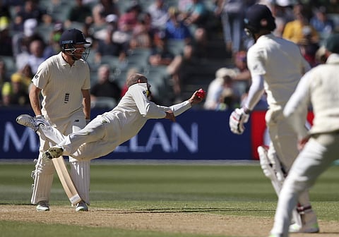 Australia's Nathan Lyon, second left, catches out England's Moeen Ali, second right, for 25 runs during the third day of their Ashes Test match in Adelaide, Monday, Dec. 4, 2017. | AP