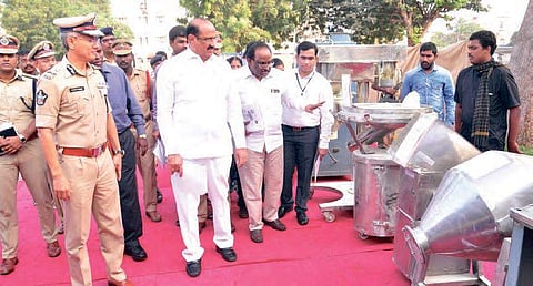 Health Minister Kamineni Srinivas and Police Commisioner Gautam Sawang take a look at the seized drug manufacturing equipment at the Police Command Control Centre in Vijayawada on Monday;