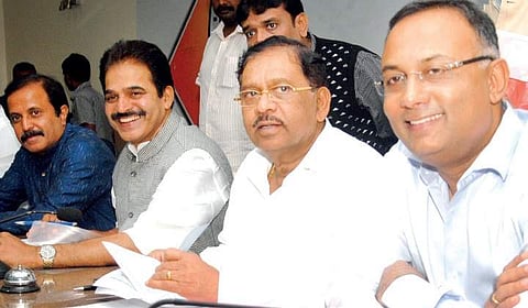 AICC general secretary K C Venugopal, KPCC party president G Parameshwara and working president Dinesh Gundu Rao at KPCC office on Tuesday | Express