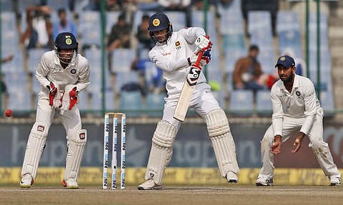 Sri Lanka's Dhananjaya De Silva, center, plays a shot during the fifth day of their third Test match against India in New Delhi, India, Wednesday, Dec. 6, 2017. | AP