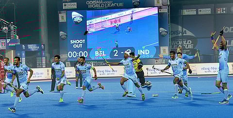 Indian players jubiliate after win 2nd Quarter final match against Belgium in penalty shoot out during Men's Hockey World League Final at Kalinga Stadium in Bhubaneswar on Wednesday night. | PTI