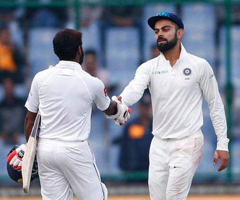India's captain Virat Kohli shakes hand with Sri Lanka's Niroshan Dickwella at the end of third test | AP