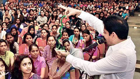 Magician Gopinath Muthukad conducting an awareness programme on cyber safety issues and their implications at St Teresa’s College in Kochi on Wednesday | Albin Mathew