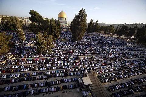 Palestinians pray during the Muslim holiday of Eid al-Adha, near the Dome of the Rock Mosque in the Al Aqsa Mosque compound in Jerusalem's old city. (AP File Photo)