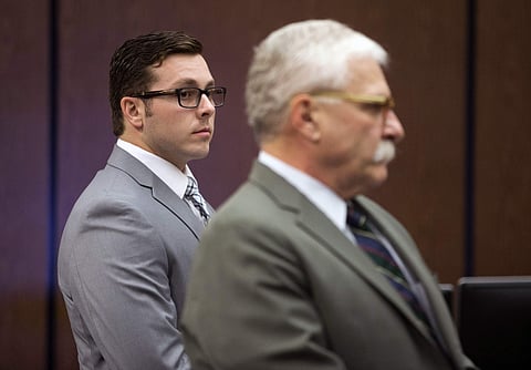 Former Mesa police officer Philip Brailsford (L) with his attorney | AP