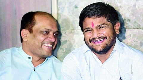 Patidar Anamat Andolan Samiti leader Hardik Patel with Dinesh Bhambaniya. (File | PTI)