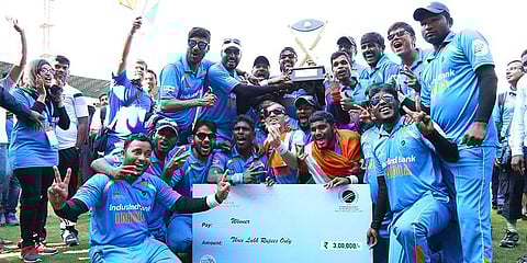 The Indian blind cricket team with their trophy (Twitter: @BCCI)