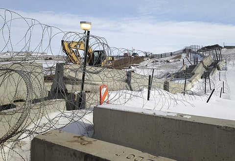 Razor wire and concrete barriers protect access to the Dakota Access pipeline drilling site Thursday, Feb. 9, 2017 near Cannon Ball, North Dakota. | AP