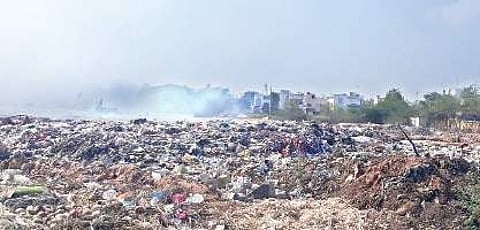 The heaps of solid waste piled up for the last two weeks at the Excel Plant owned by Vijayawada Municipal Corporation | Express