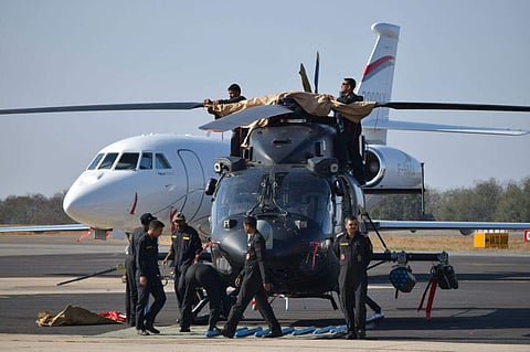 Crew prepare a helicopter during the Aero India 2017 at Bengaluru. | Express Photo Service