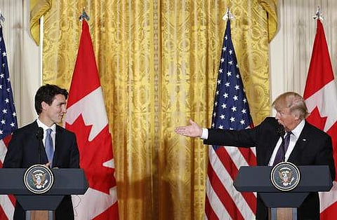 President Donald Trump and Canadian Prime Minister Justin Trudeau participate in a joint news conference in the East Room of the White House in Washington. | AP