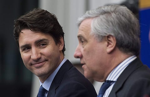 Canadian PM Justin Trudeau smiles as he listens to the President of the European Parliament, Antonio Tajani, right, respond to a question during a joint news conference at the European Parliament in Strasbourg, France, Feb. 16, 2017. (Photo | AP)