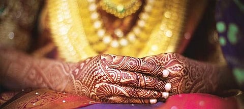 A close-up of a bride’s hands