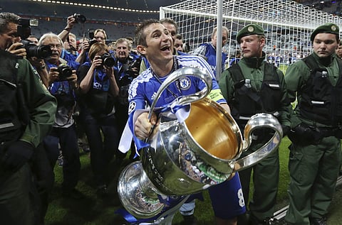 This Saturday May 19, 2012, file photo shows Frank Lampard holding the trophy at the end of the Champions League final soccer match between Bayern Munich and Chelsea in Munich. | AP