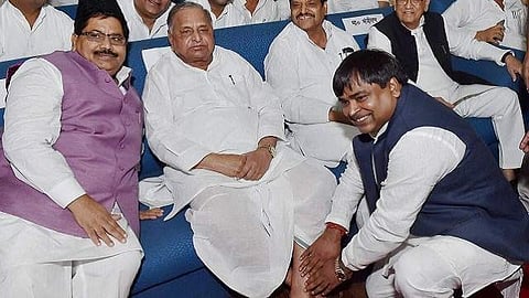 Gayatri Prajapati with Samajwadi Party leaders at a rally. (File Photo | PTI)