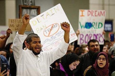 Protestors demonstrate against President Donald Trump's travel ban barring citizens of seven predominantly Muslim nations entry into the US. | AP