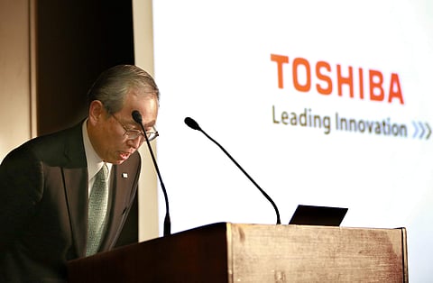 Toshiba Corp. President Satoshi Tsunakawa bows during a press conference at the company's headquarters in Tokyo. (Photo | AP)