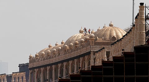 File photo: Workers gild the dome of a grand pavilion ahead of the World Cultural Festival being organised by s the Art of Living foundation in New Delhi on the banks of the Yamuna. I Express Photo