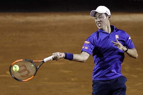 Japan's Kei Nishikori returns the ball to Brazil's Thomaz Bellucci at the Rio Open tennis tournament in Rio de Janeiro, Brazil, Tuesday, Feb. 21, 2017. | AP