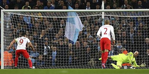 Manchester City's goalkeeper Willy Caballero, right, saves a penalty from Monaco's Radamel Falcao during the Champions League round of 16 first leg soccer match between Manchester City and Monaco at the Etihad Stadium in Manchester. | AP