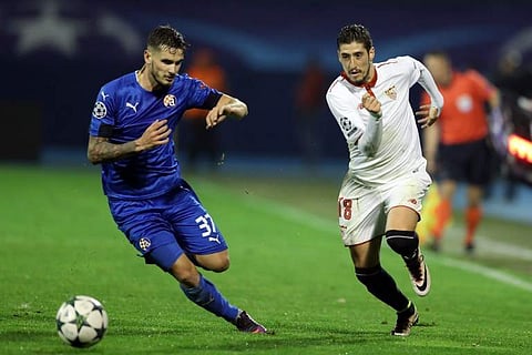 Sevilla left-back Sergio Escudero (R) | AFP
