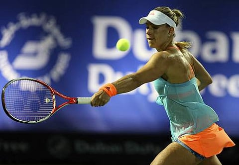 Angelique Kerber of Germany returns the ball to Ana Konjuh of Croatia during a quarter final match of the Dubai Tennis Championships in Dubai. | AP