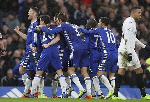 Chelsea players celebrate the goal of Chelsea's Pedro during the English Premier League soccer match between Chelsea and Swansea City at Stamford Bridge stadium. | AP