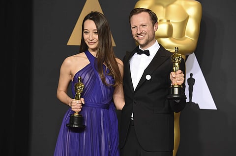 Joanna Natasegara, left, and Orlando von Einsiedel, winners of the award for for best documentary short subject for 'The White Helmets', pose in the press room at the Oscars on Sunday, Feb. 26, 2017 (Photo | AP)