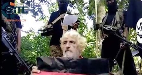 In this undated image made from militant video and released by SITE Intel Group on Feb. 24, 2017, shows German hostage Jurgen Gustav Kantner at an undisclosed location. Abu Sayyaf extremists in the Philippines have released a video of the beheading of Kan
