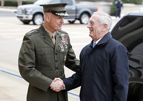 In this Jan. 21, 2107 file photo, Joint Chiefs Chairman Gen. Joseph Dunford greets Defense Secretary Jimn Mattis at the Pentagon. | AP