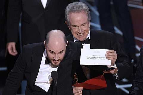 Jordan Horowitz, producer of 'La La Land,' shows the envelope revealing 'Moonlight' as the true winner of best picture at the Oscars on Sunday, Feb. 26, 2017, at the Dolby Theatre in Los Angeles. | AP