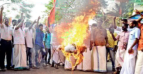 Yuva Morcha workers burning Education Minister Raveendranath's effigy in front of the Law Academy on Saturday | Manu R Mavelil