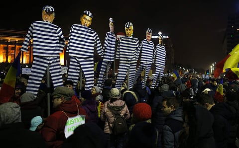 People carry effigies depicting members of Romanian government during a demonstration in Bucharest, Romania, Sunday, Feb. 5, 2017. | AP