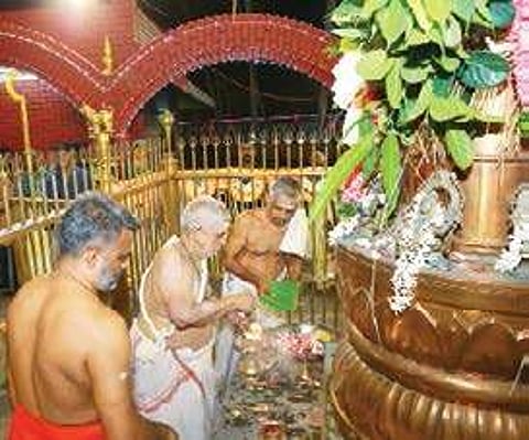 The flag hoisting ritual at Thozhuvancode temple on Monday