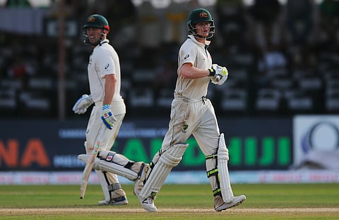 Australia's Steve Smith, right, and Shaun Marsh run between wickets during the day two of their third test cricket match against Sri Lanka in Colombo, Sri Lanka, Sunday, Aug. 14, 2016. | AP