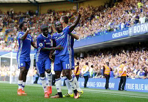 Chelsea's Victor Moses, center front, celebrates with teammates after scoring during the English Premier League soccer match between Chelsea and Burnley at Stamford Bridge in London, Saturday, Aug. 27, 2016. | AP