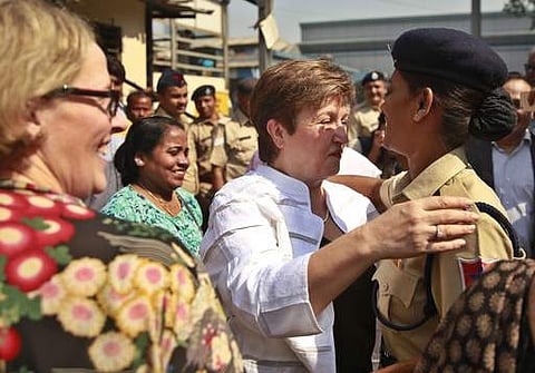 World Bank Chief Executive Officer Kristalina Georgieva, second right, greets an Indian railway police officer after taking a trip in a suburban train in Mumbai on February 28. (Photo | AP)