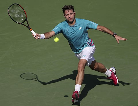 Stan Wawrinka of Switzerland returns the ball to Damir Dzumhur of Bosnia-Herzegovina during the Dubai Tennis Championships, in Dubai, United Arab Emirates, Tuesday, Feb. 28, 2017. | AP