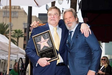Actors John Goodman, Jeff Bridges (right) attend Goodman's star unveiling ceremony on the Hollywood walk of fame. (Photo | AFP)