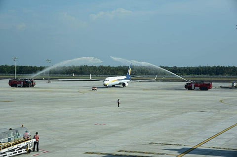 The first aircraft that arrived at the newly inaugurated international terminal of Cochin International Airport being received with water salute in Kochi. (Photo | EPS/ Albin Mathew)