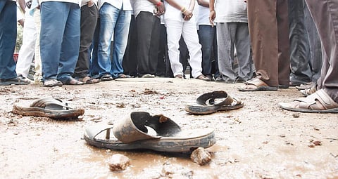 Footwears of the deceased, P Venkateswarlu and Koganti Rambabu, laying near the manwhole at Bhavanipuram police limits in Vijayawada on Wednesday | R V K Rao