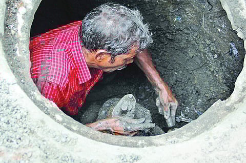 A sewage worker in Hyderabad. | EPS