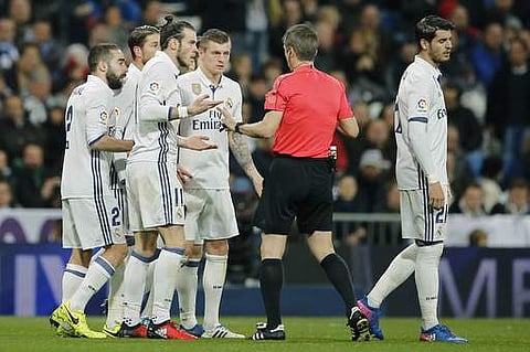 Real Madrid's Gareth Bale, 3rd left protests to the referee after receiving a red card during a Spanish La Liga soccer match between Real Madrid and Las Palmas at the Santiago Bernabeu stadium in Madrid. | AP