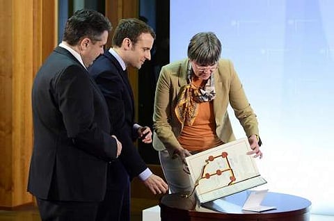 French presidential election candidate Emmanuel Macron (C). (File photo | AFP)