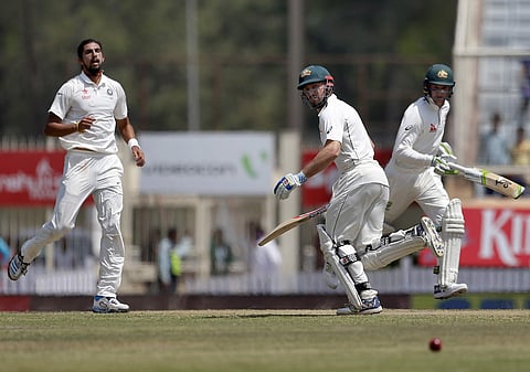 India's Ishant Sharma, left, watches as Australia's Peter Handscomb, right, and Shaun Marsh run between the wickets to score runs during the fifth day of their third test cricket match against India in Ranchi, India, Monday, March 20, 2017. | AP